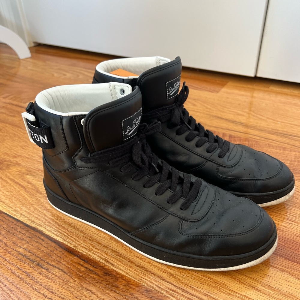 Black Louis Vuitton high top sneakers.